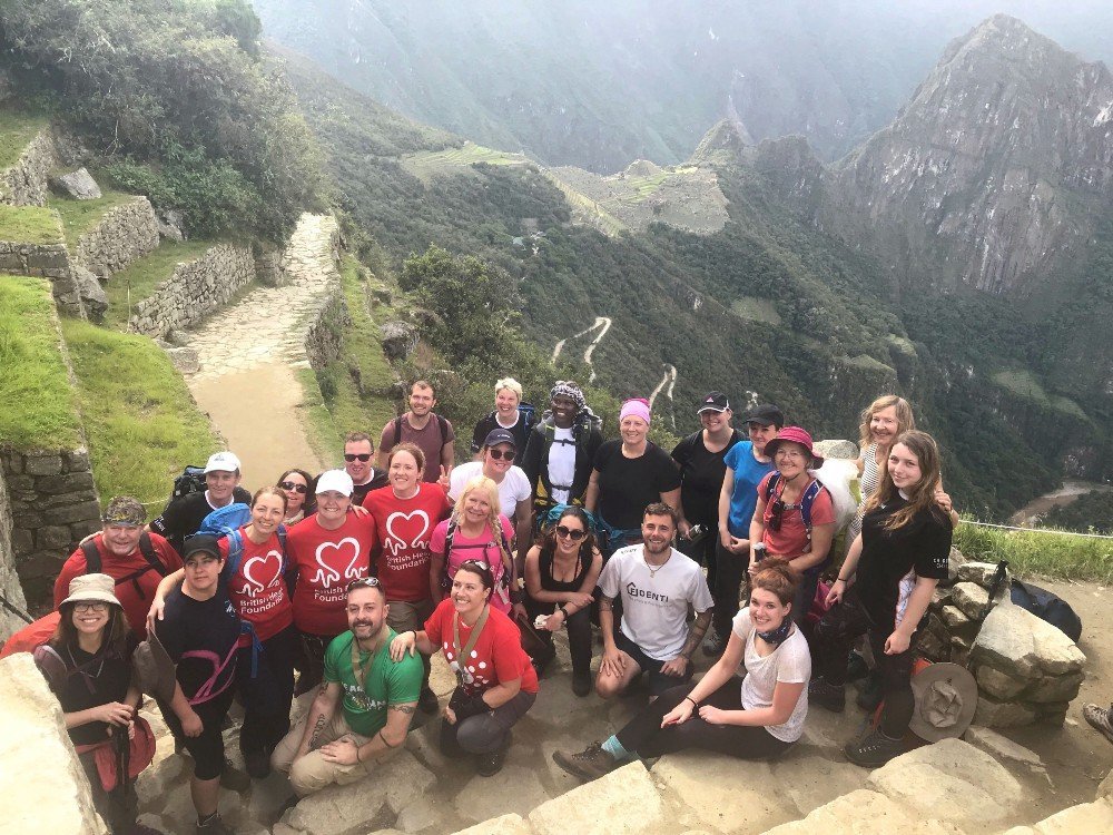 Group photo with mountains in background