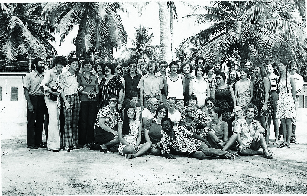 Black and white group photo in tropical location