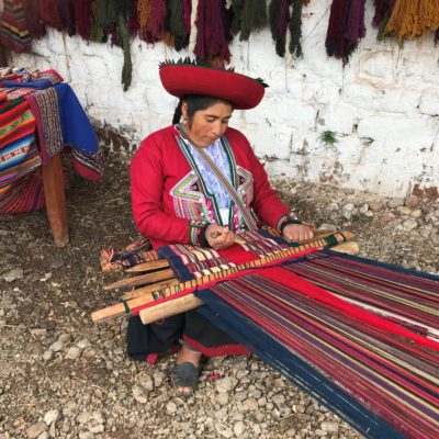 Woman weaving fabric