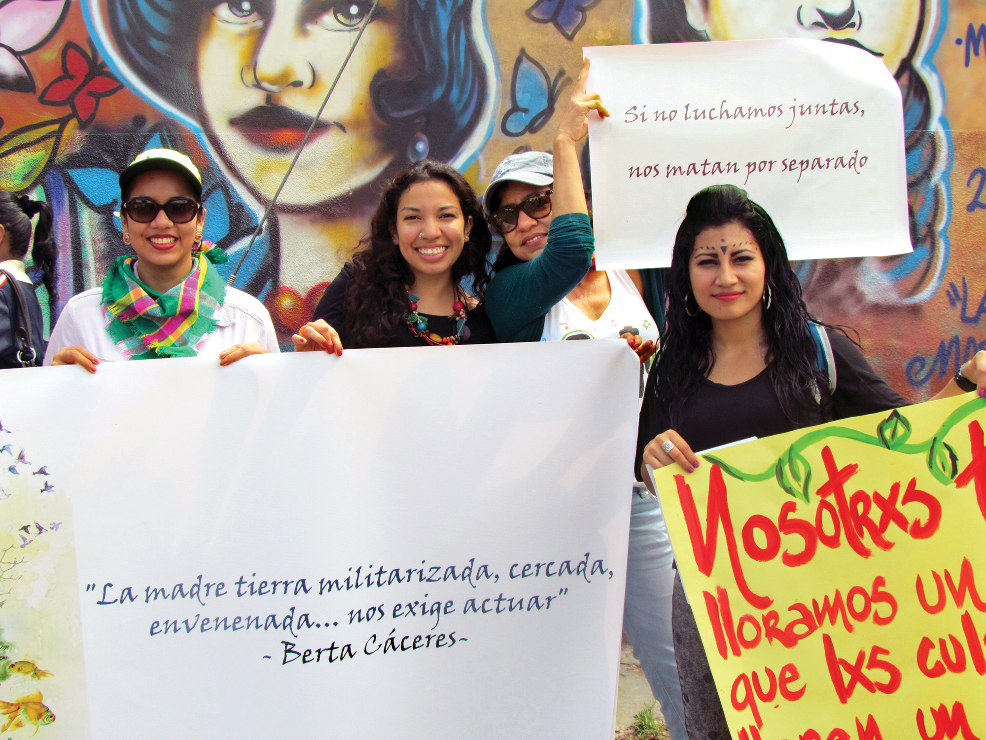 Women holding banners and signs
