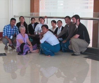 Group of people sitting on ground
