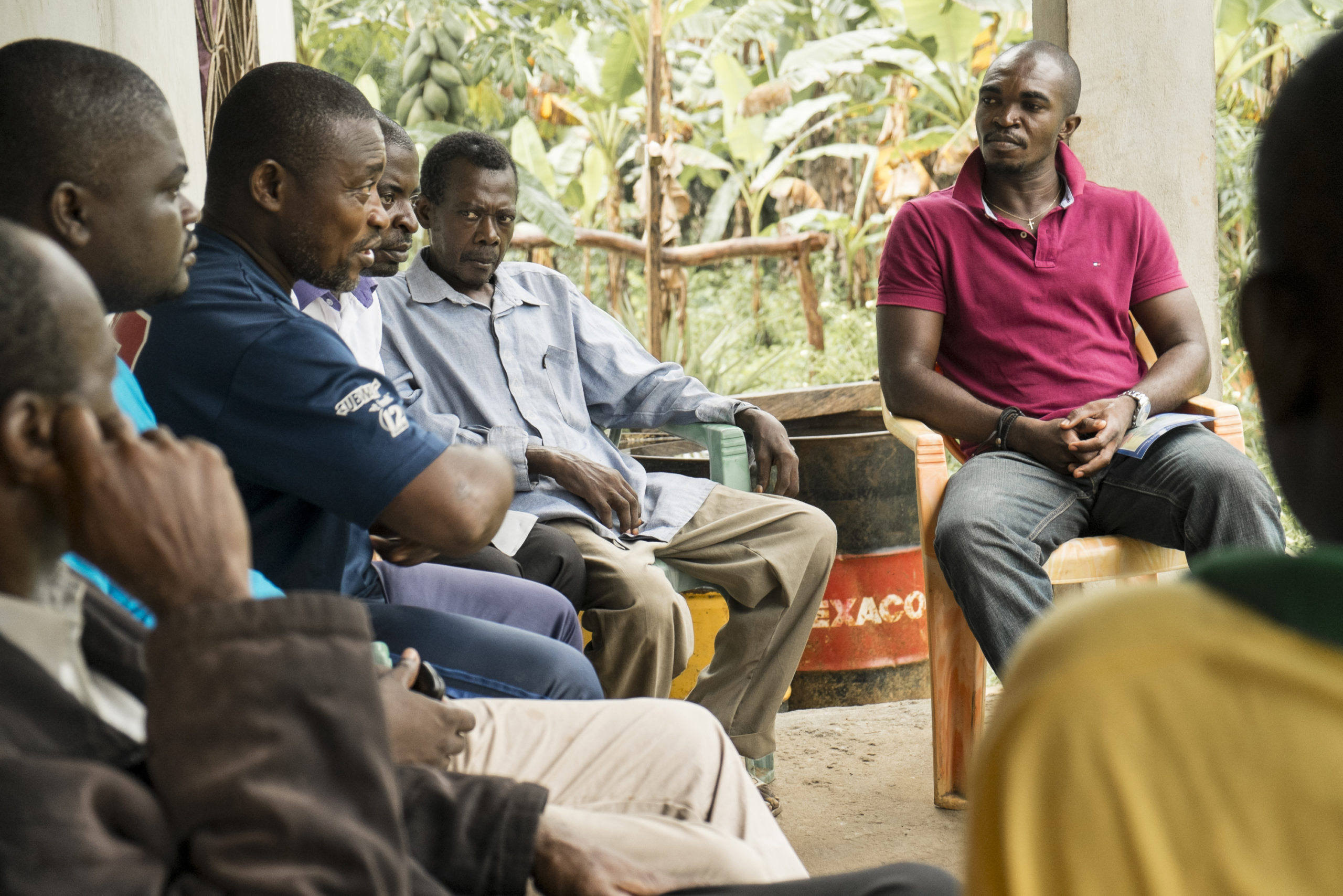 Men sitting in circle