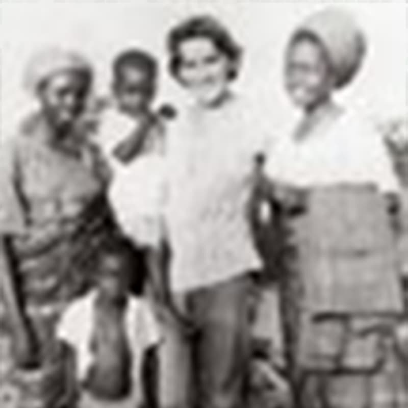 Black and white image of a Marian standing with two children and two women