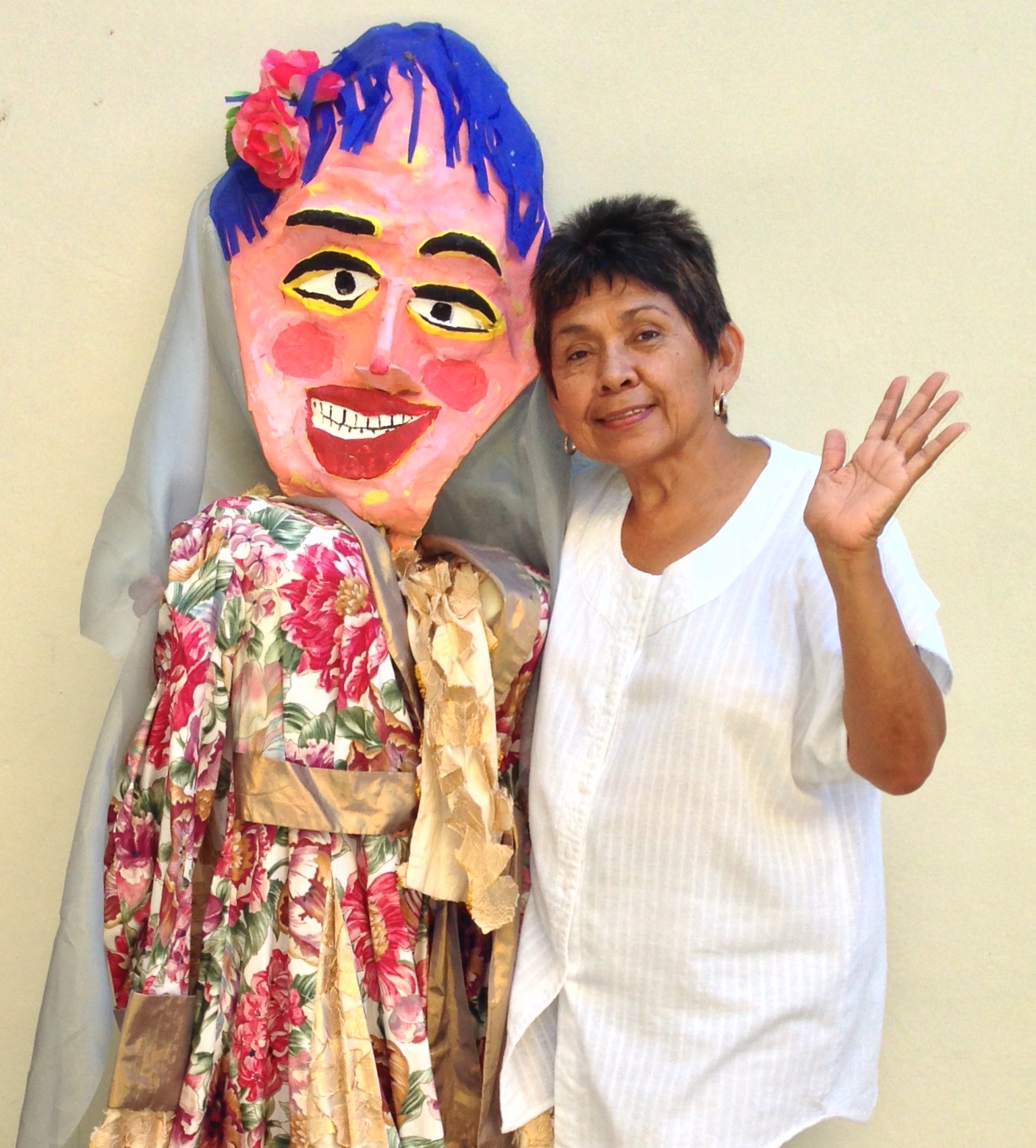 Woman with a person wearing a decorative mask